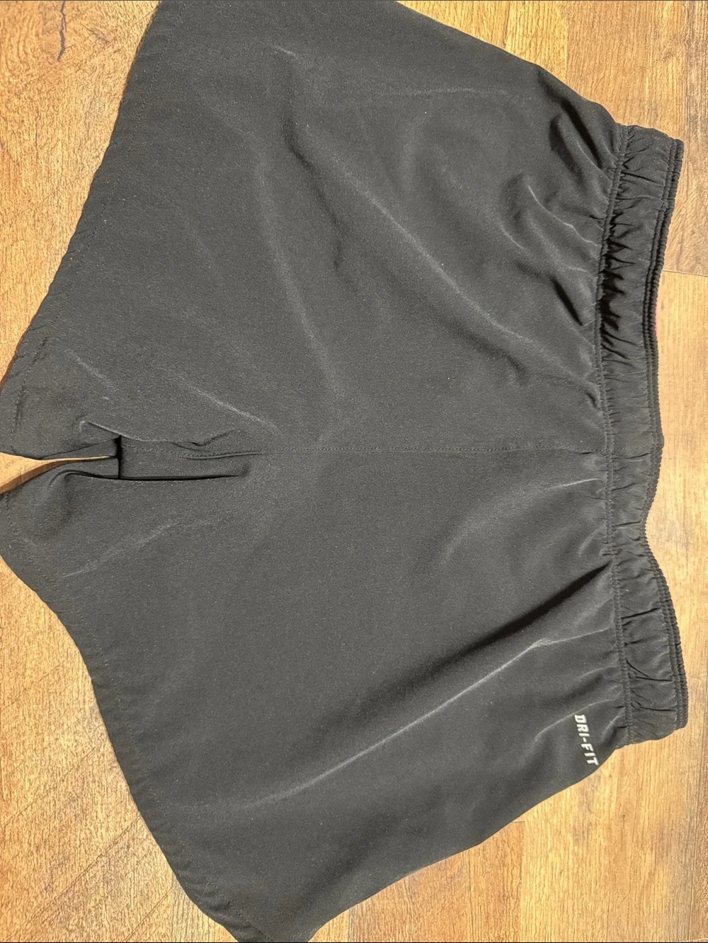 Nike Black Women's Athletic Shorts with Pink Swoosh